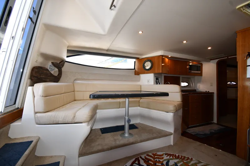 Slide: The Image of Interior of 2002 Carver 350 Mariner yacht with cozy seating and modern amenities. - 39