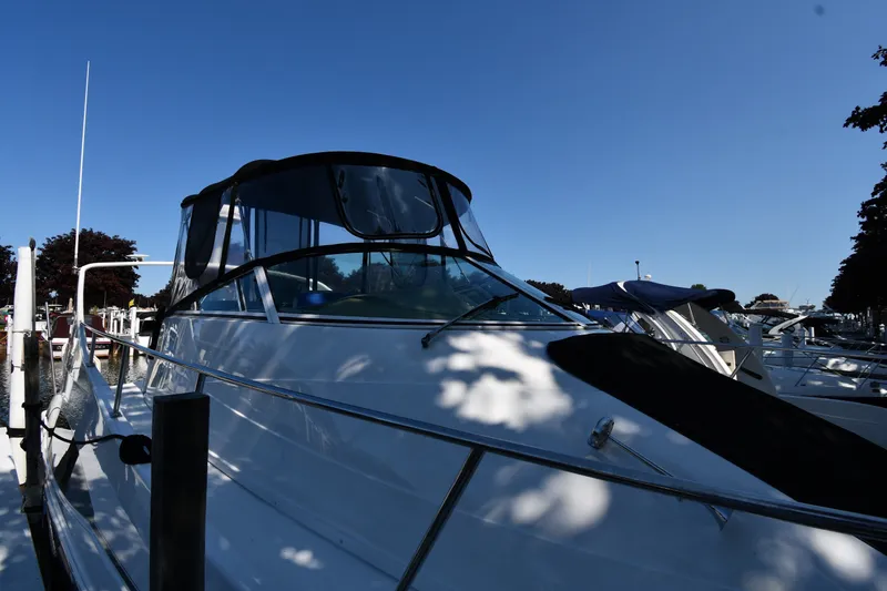 Slide: The Image of 2002 Carver 350 Mariner yacht docked under clear blue sky. - 2