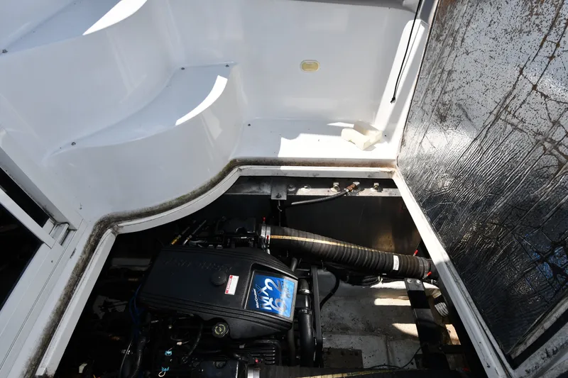 Slide: The Image of Engine compartment of a 2002 Carver 350 Mariner boat, showcasing mechanical components. - 51