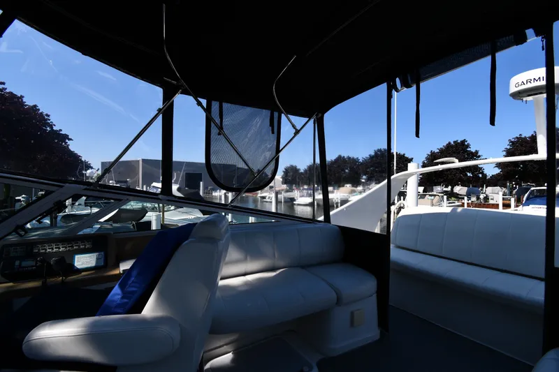 Slide: The Image of Interior view of 2002 Carver 350 Mariner yacht with seating and navigation equipment. - 27