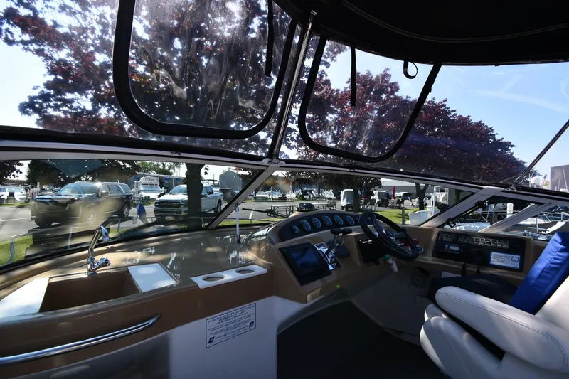 Slide: The Image of Interior view of 2002 Carver 350 Mariner yacht cockpit with steering wheel and dashboard. - 17