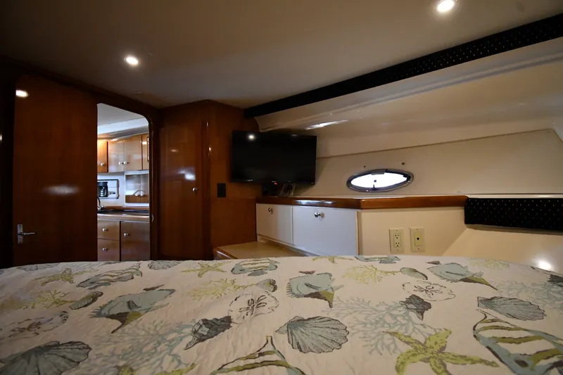 Slide: The Image of Interior of 2002 Carver 350 Mariner yacht with cozy bedroom and kitchenette. - 32