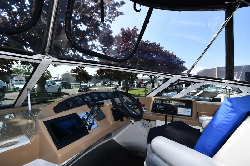 Slide: The Image of Interior view of 2002 Carver 350 Mariner yacht cockpit with steering wheel and control panel. - 18