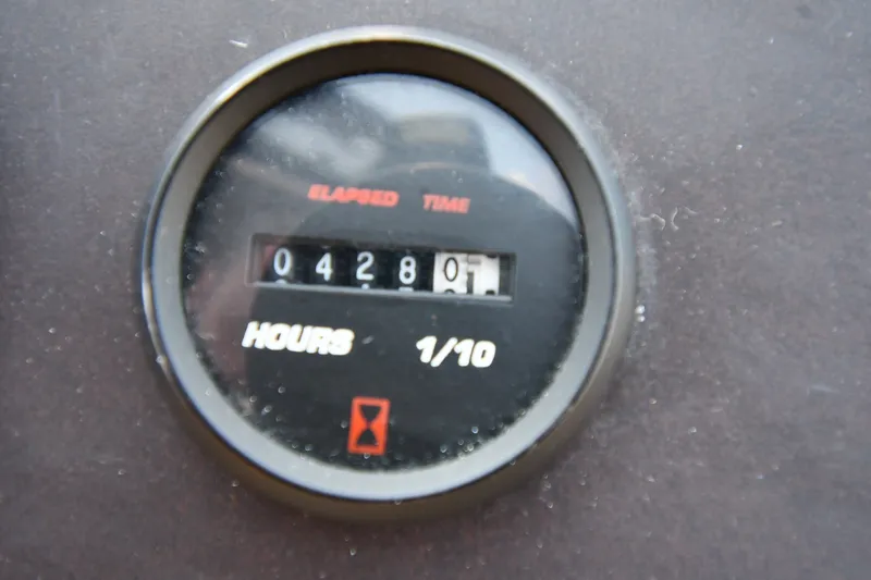 Slide: The Image of Hour meter showing 428.1 hours on 2002 Carver 350 Mariner. - 22