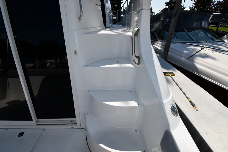 Slide: The Image of Staircase on a 2002 Carver 350 Mariner yacht, docked beside another boat. - 13