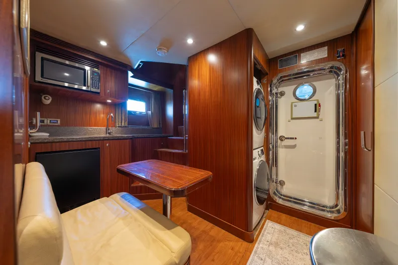 Slide: The Image of Luxurious interior of 2013 Ocean Alexander 90 Skylounge Motoryacht with kitchenette and seating area. - 45