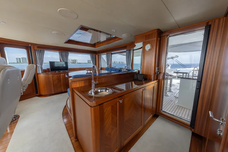 Slide: The Image of Luxurious interior of 2013 Ocean Alexander 90 Skylounge Motoryacht with elegant wood finishes. - 9