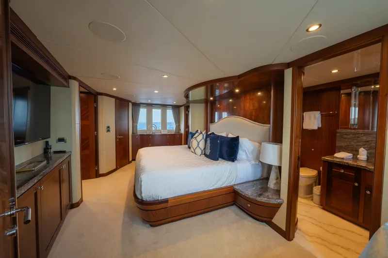 Slide: The Image of Luxurious bedroom in 2013 Ocean Alexander 90 Skylounge Motoryacht with elegant wood finishes. - 30