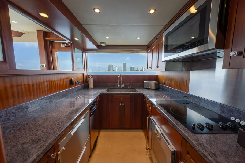 Slide: The Image of Luxurious kitchen in 2013 Ocean Alexander 90 Skylounge Motoryacht with modern appliances and ocean view. - 25