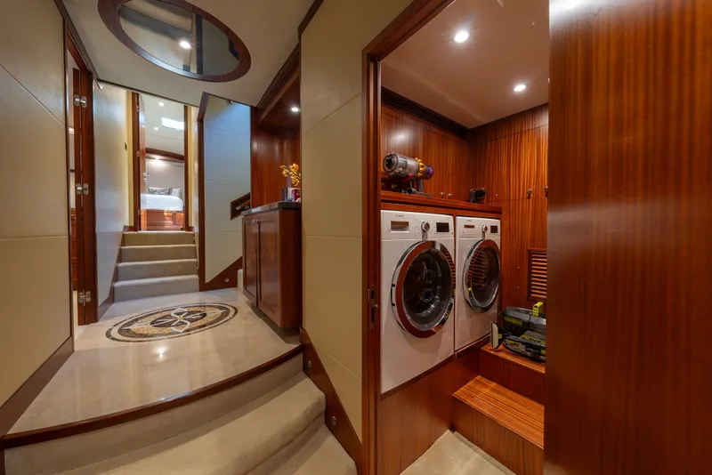 Slide: The Image of Luxurious interior of 2013 Ocean Alexander 90 Skylounge Motoryacht with laundry area and elegant wood finishes. - 44