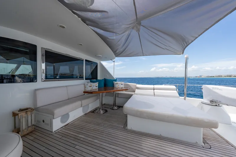Slide: The Image of Luxurious Ocean Alexander 90 Skylounge Motoryacht deck with seating, ocean view, and canopy. - 57