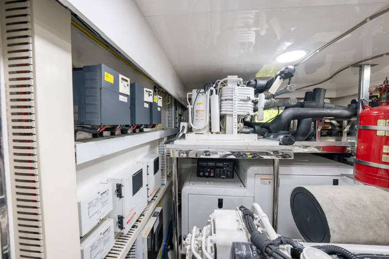 Slide: The Image of Engine room of 2013 Ocean Alexander 90 Skylounge Motoryacht, showcasing electrical systems and machinery. - 51