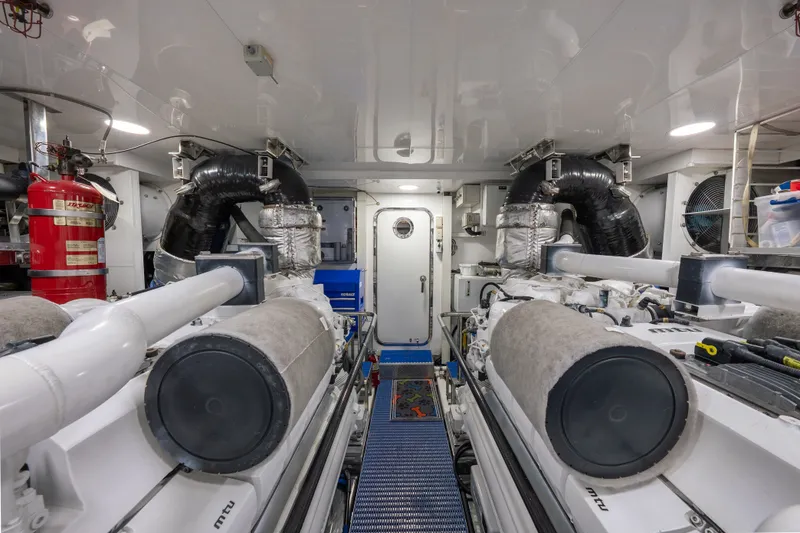 Slide: The Image of Engine room of 2013 Ocean Alexander 90 Skylounge Motoryacht, featuring dual engines and equipment. - 50