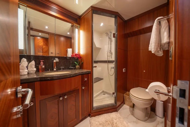 Slide: The Image of Luxurious bathroom in 2013 Ocean Alexander 90 Skylounge Motoryacht with wood accents and modern fixtures. - 38