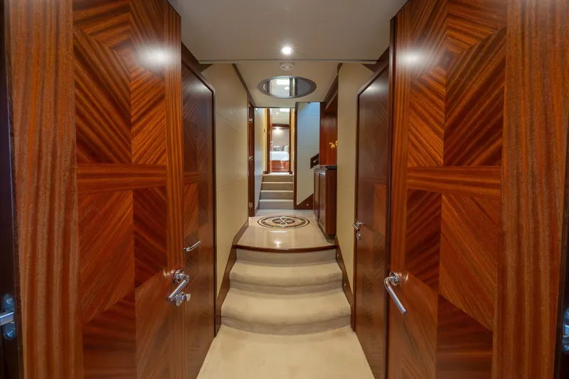 Slide: The Image of Luxurious interior hallway of 2013 Ocean Alexander 90 Skylounge Motoryacht with elegant wood paneling. - 43
