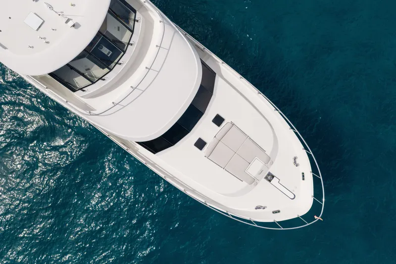 Slide: The Image of Aerial view of 2013 Ocean Alexander 90 Skylounge Motoryacht on blue ocean water. - 59