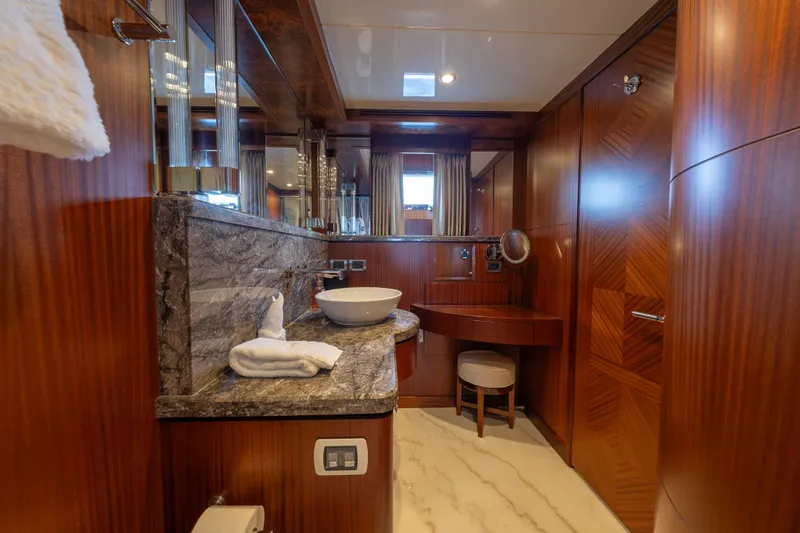 Slide: The Image of Luxurious bathroom in 2013 Ocean Alexander 90 Skylounge Motoryacht with elegant wood and marble finishes. - 36