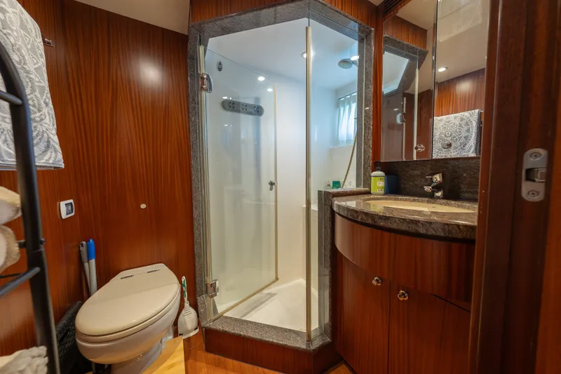 Slide: The Image of Luxurious bathroom in 2013 Ocean Alexander 90 Skylounge Motoryacht with wood accents and modern fixtures. - 49