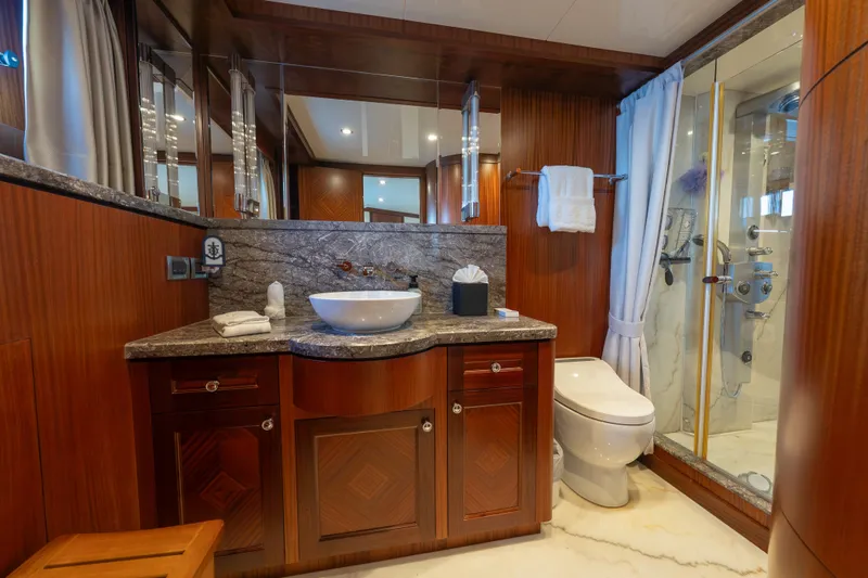 Slide: The Image of Luxurious bathroom in 2013 Ocean Alexander 90 Skylounge Motoryacht with elegant wood and marble finishes. - 33