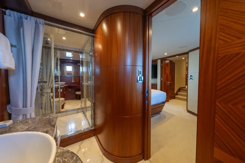Slide: The Image of Luxurious interior of 2013 Ocean Alexander 90 Skylounge Motoryacht with elegant wood finishes. - 32