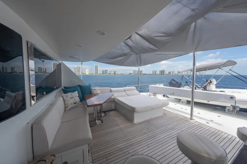 Slide: The Image of Luxurious deck of 2013 Ocean Alexander 90 Skylounge Motoryacht with city skyline view. - 55