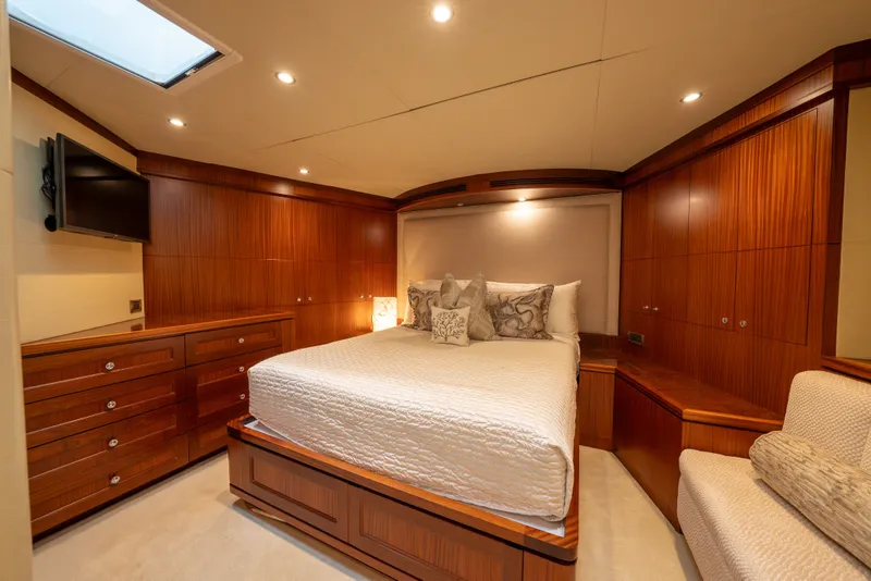 Slide: The Image of Luxurious bedroom in 2013 Ocean Alexander 90 Skylounge Motoryacht with elegant wood paneling. - 37