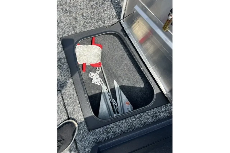Slide: The Image of Storage compartment in 2025 Tracker Pro Guide V-175 SC boat with anchor and rope. - 30