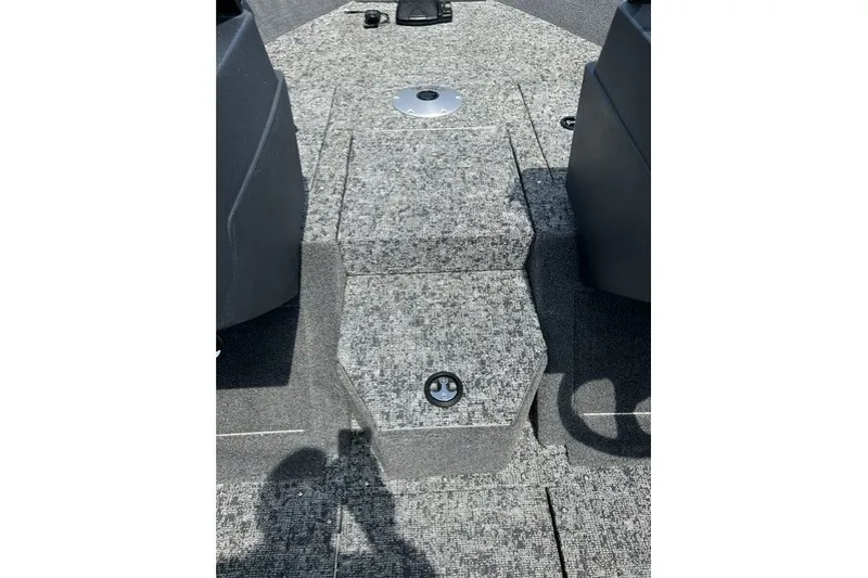 Slide: The Image of 2025 Tracker Pro Guide V-175 SC boat interior with gray carpeted flooring. - 20