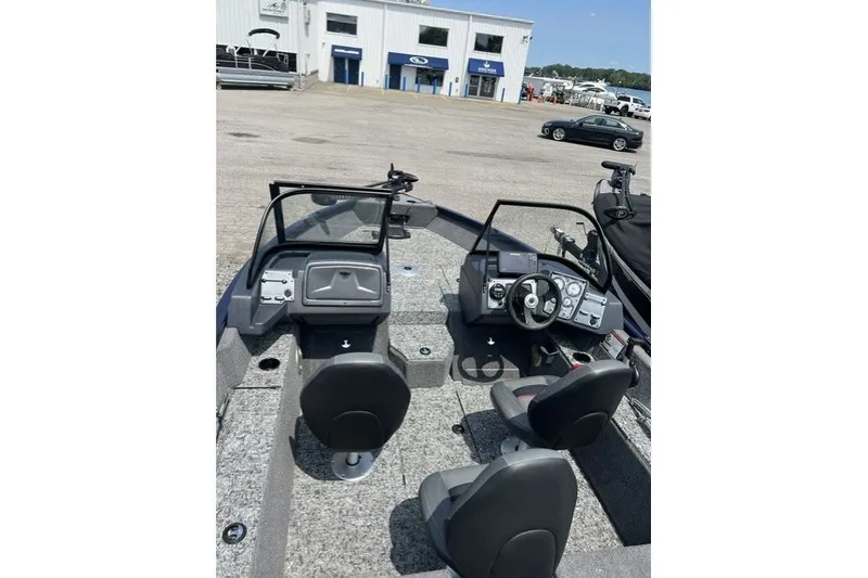 The Image of 2025 Tracker Pro Guide V-175 SC boat interior with dual consoles and seating. - 0