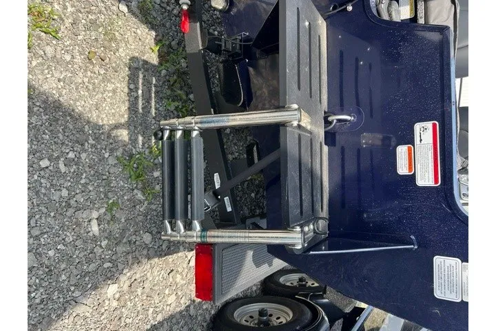 Slide: The Image of Rear view of 2025 Tracker Pro Guide V-175 SC boat with ladder and trailer. - 31