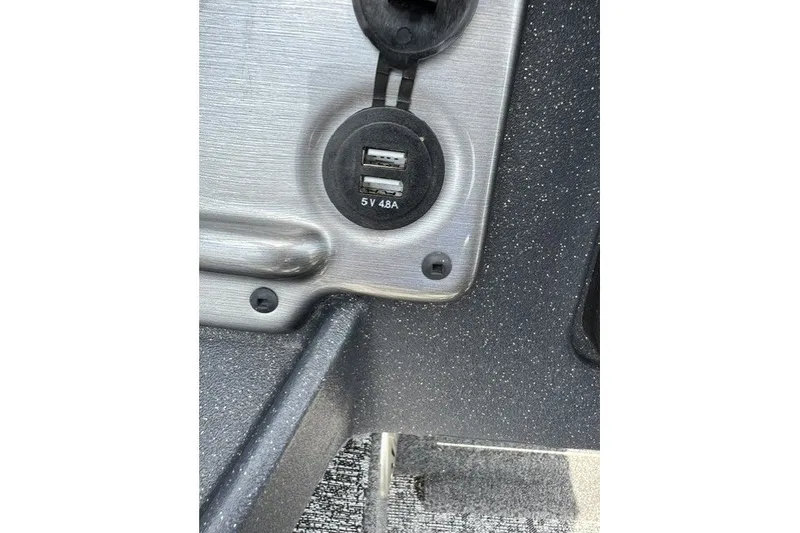 Slide: The Image of USB charging ports on 2025 Tracker Pro Guide V-175 SC boat dashboard. - 17