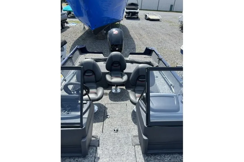 Slide: The Image of 2025 Tracker Pro Guide V-175 SC boat interior with seating and steering wheel. - 5