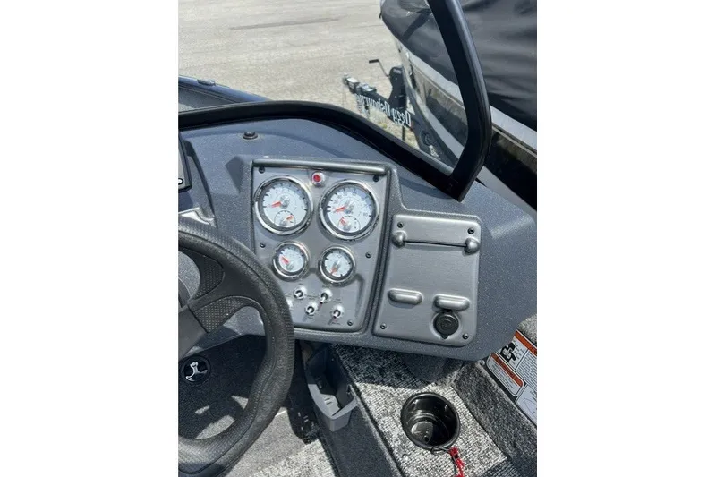 Slide: The Image of Dashboard of 2025 Tracker Pro Guide V-175 SC boat with gauges and controls. - 14
