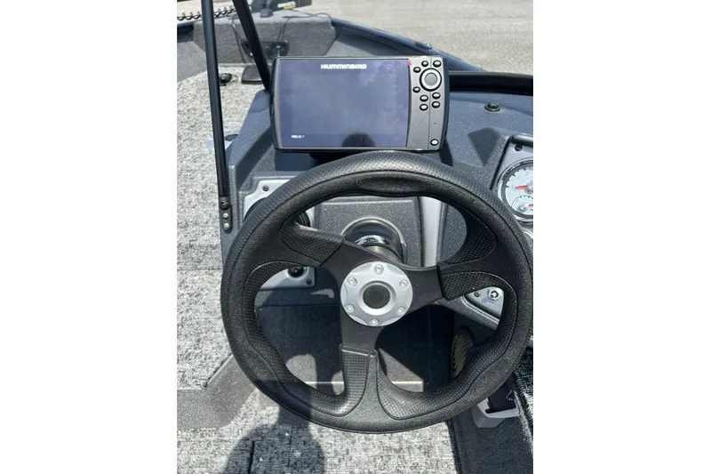 Slide: The Image of Steering wheel and dashboard of 2025 Tracker Pro Guide V-175 SC boat with Humminbird display. - 13