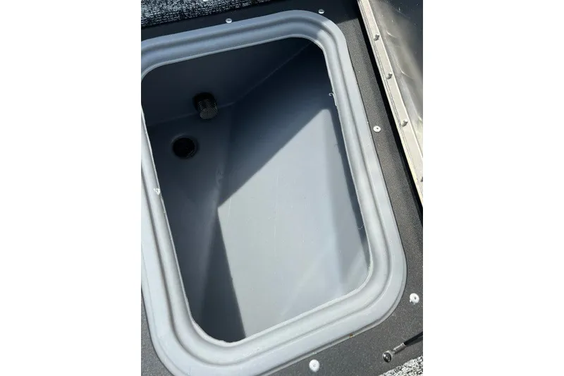 Slide: The Image of Livewell compartment in 2025 Tracker Pro Guide V-175 SC boat, featuring durable construction. - 24