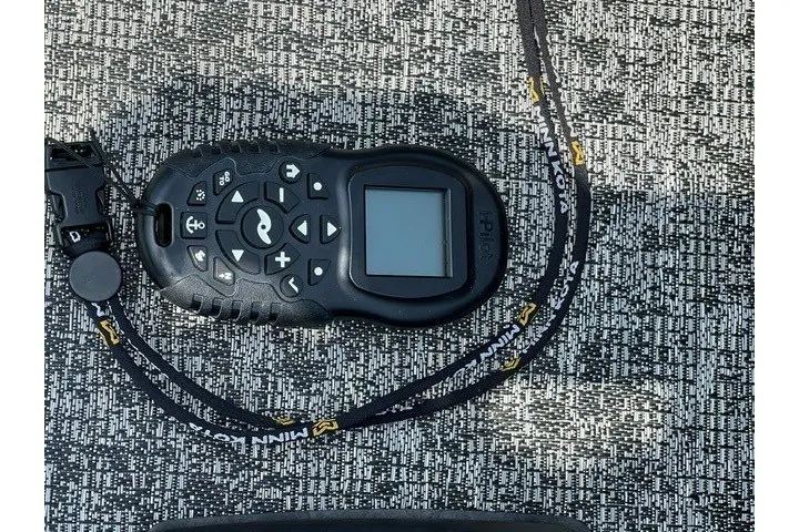Slide: The Image of Remote control on a textured surface, Tracker Pro Guide V-175 SC, 2025 model. - 11