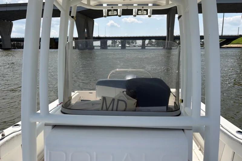 Slide: The Image of 2019 Robalo R222 Center Console boat on water near a bridge. - 8