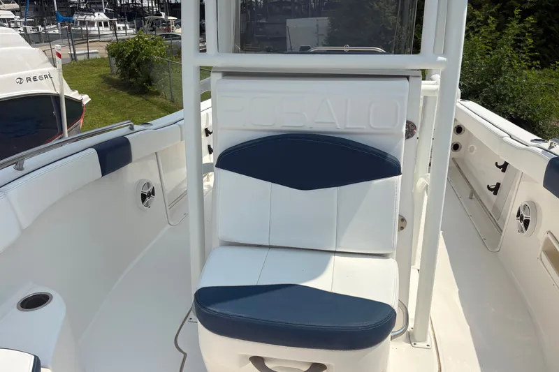 Slide: The Image of 2019 Robalo R222 Center Console boat interior with seating and storage. - 8