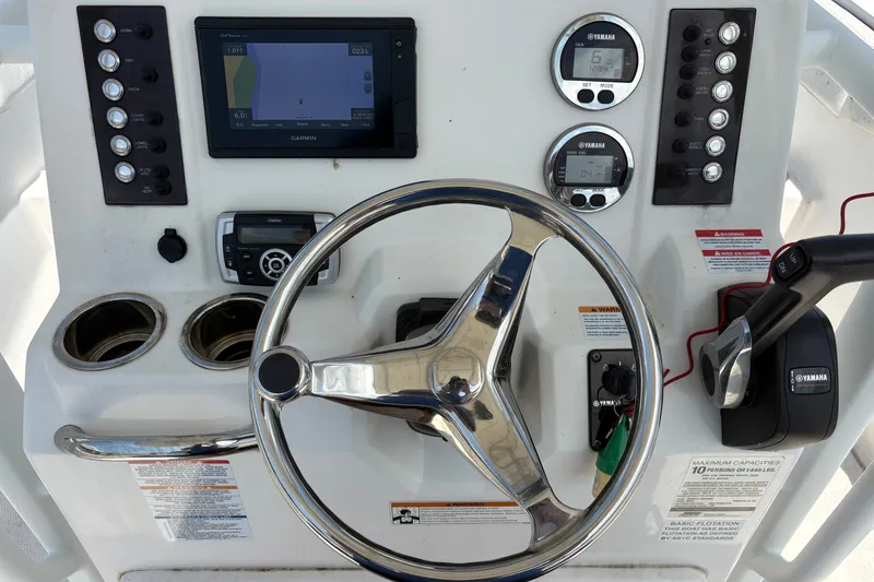 Slide: The Image of 2019 Robalo R222 Center Console dashboard with Garmin display and Yamaha controls. - 4