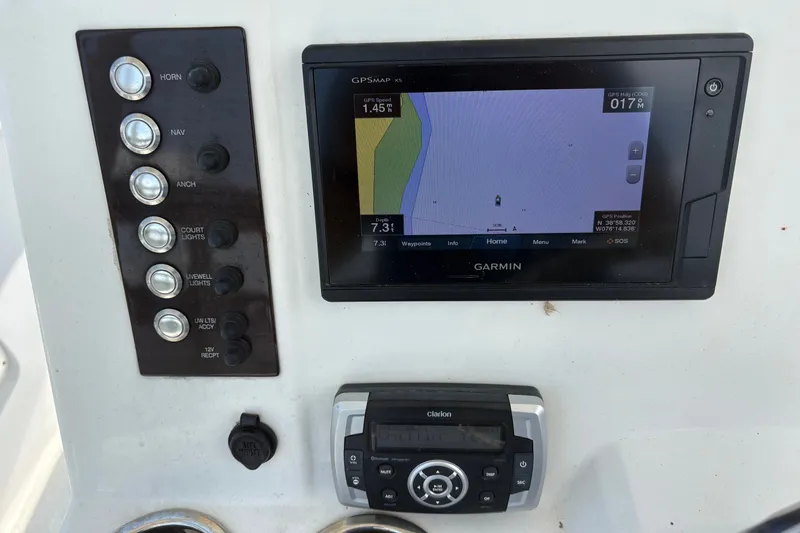 Slide: The Image of 2019 Robalo R222 Center Console dashboard with Garmin GPS and control panel. - 6