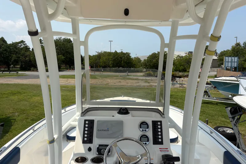 Slide: The Image of 2019 Robalo R222 Center Console boat interior with Garmin navigation system. - 10