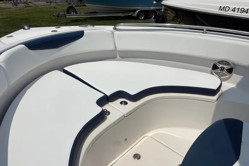 Slide: The Image of 2019 Robalo R222 Center Console boat interior with cushioned seating and speaker. - 9