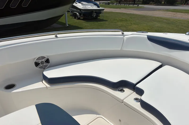 Slide: The Image of 2019 Robalo R222 Center Console boat interior with cushioned seating and speaker. - 7