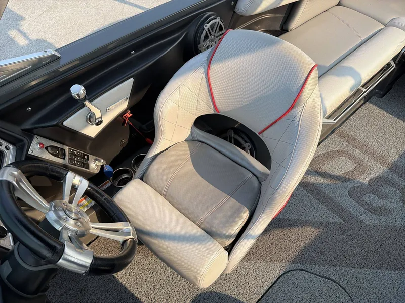 Slide: The Image of The image shows the interior of a 2015 MasterCraft X30 with a sleek steering wheel and comfortable seating. - 19