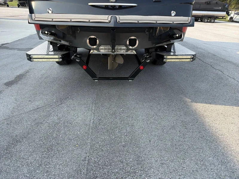 Slide: The Image of Rear view of a 2015 MasterCraft X30 with dual exhaust pipes and a propeller. - 7