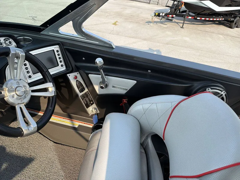 Slide: The Image of The image shows the cockpit of a 2015 MasterCraft X30 with a modern steering wheel and controls. - 16