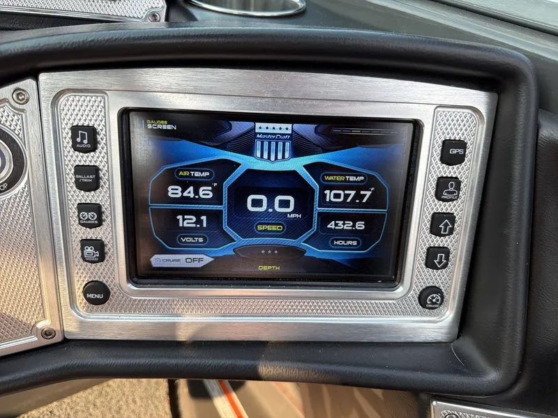 Slide: The Image of The dashboard of a 2015 MasterCraft X30 displays temperature and speed readings. - 11