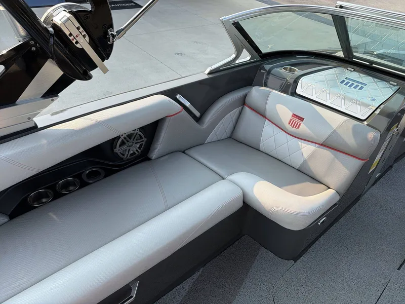 Slide: The Image of The image shows the interior of a 2015 MasterCraft X30 boat with sleek seating. - 26