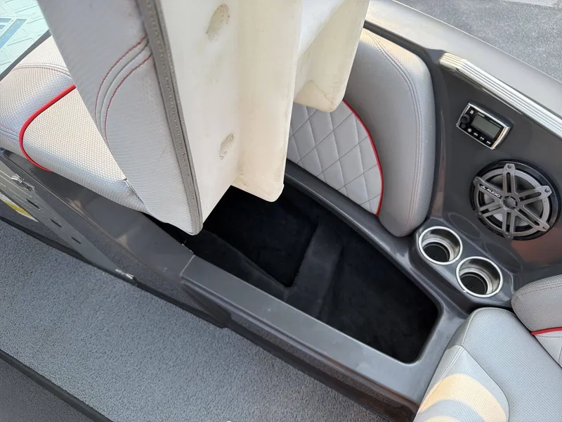 Slide: The Image of The image shows the interior of a 2015 MasterCraft X30 with gray and red seating. - 14