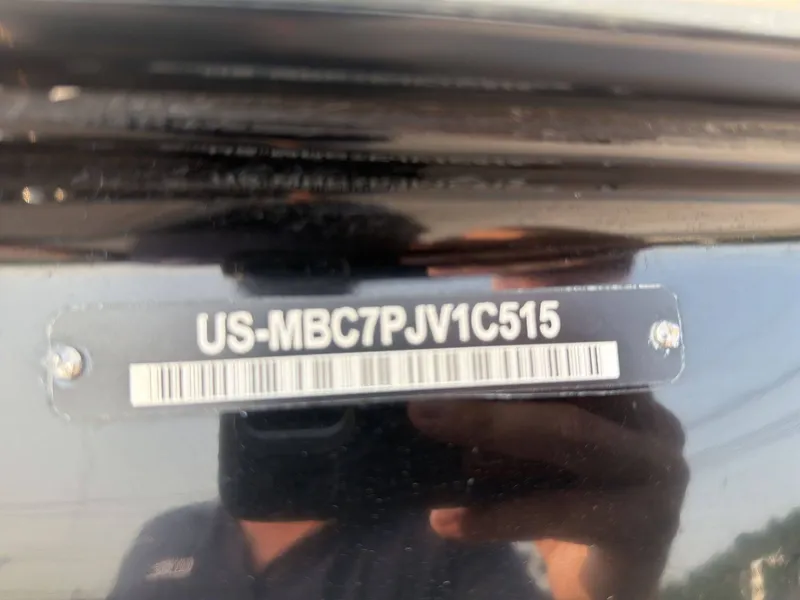 Slide: The Image of Close-up of a serial number on a boat hull. - 25